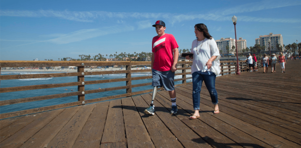 Infinite TF user and woman walking on boardwalk